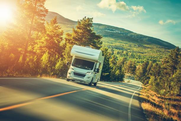 Camper Van Summer Trip. Scenic Norway Landscape and the Recreational Vehicle.